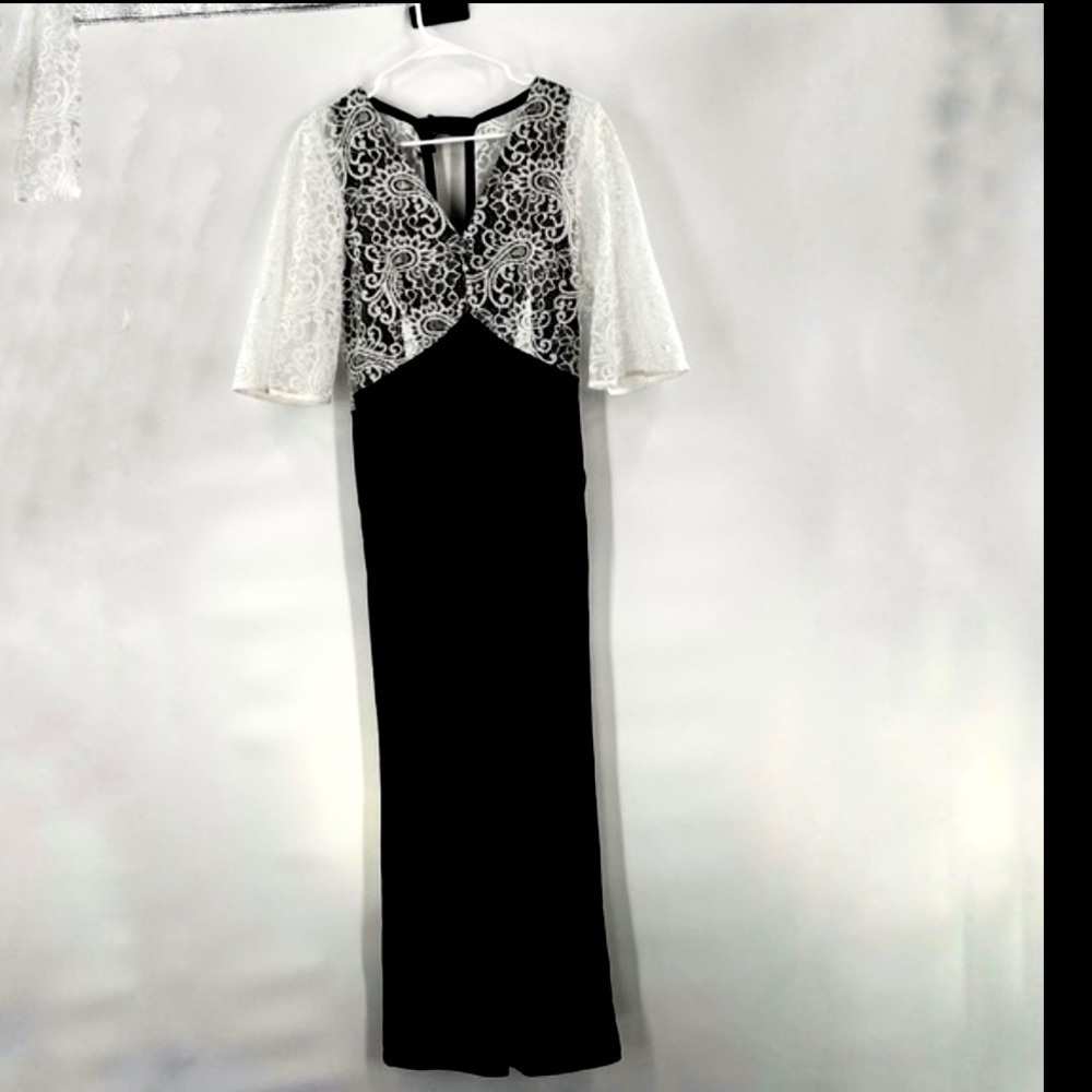 black white jumpsuit with white lace overlay and flare sleeves size S